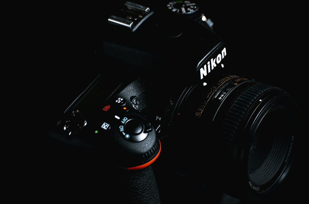 Professional broadcast camera operator working in a television studio
