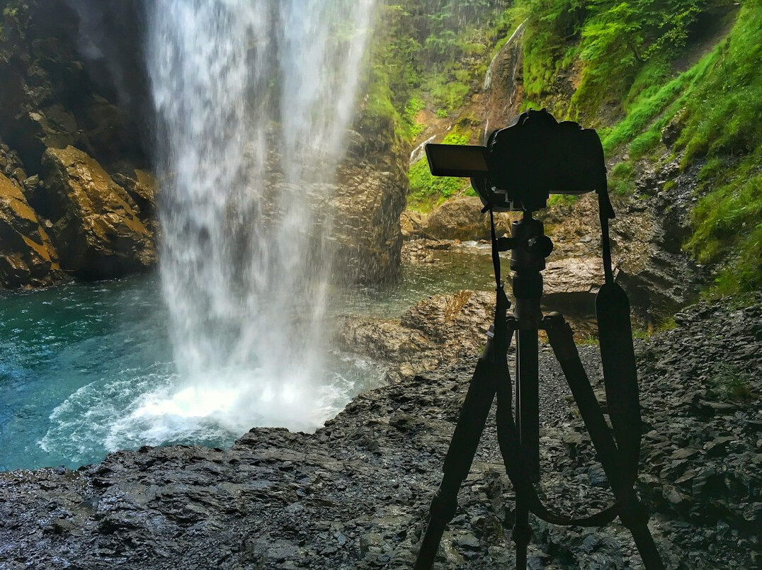 Professional video camera on a tripod outdoors